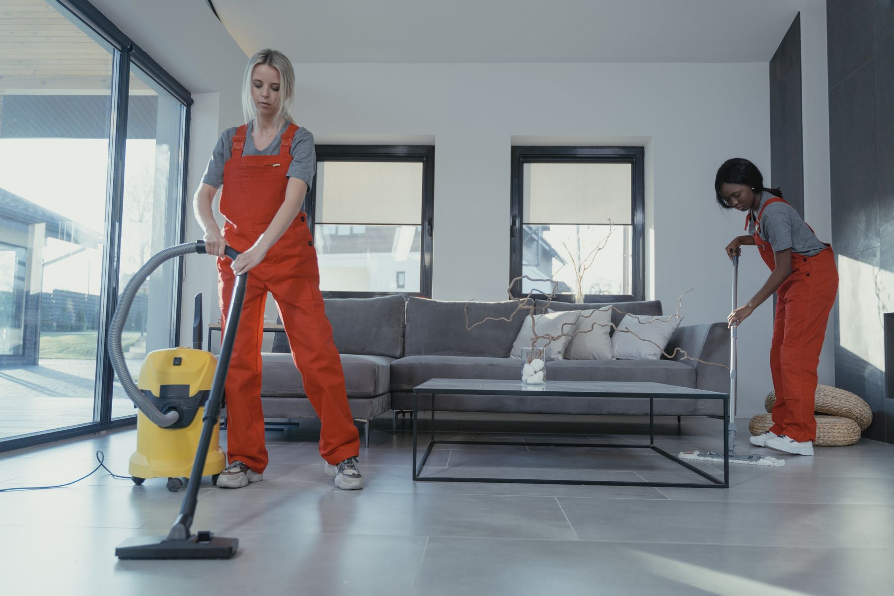 Professional cleaners vacuuming and mopping — commercial cleaning Pittsburgh PA